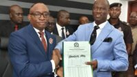 L- R : The Director -General, Bureau of Public Procurement (BPP) Dr. Adebowale Adedokun receiving hand over notes from the immediate past Acting Director-General BPP. Barr. Olusegun Omotola. At the hand over ceremony in the BPP conference room. Date:  November 18, 2024.