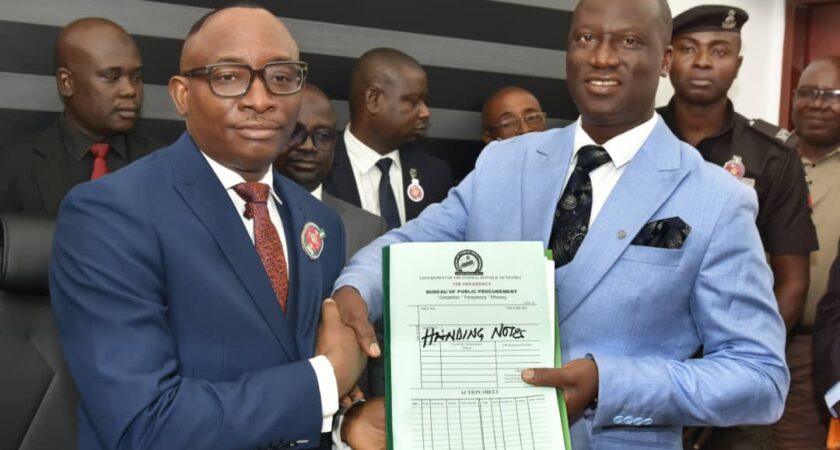 L- R : The Director -General, Bureau of Public Procurement (BPP) Dr. Adebowale Adedokun receiving hand over notes from the immediate past Acting Director-General BPP. Barr. Olusegun Omotola. At the hand over ceremony in the BPP conference room. Date:  November 18, 2024.